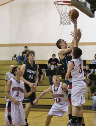 Alex Wegner powers the ball to the hoop over Seattle Christian.