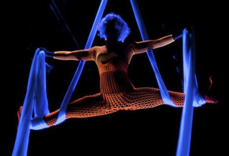 Esther Edelman will fly through the air in a black-light performance at “Chocolatada