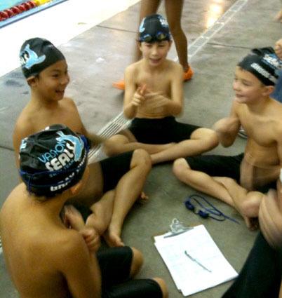 The boys 10-and-under relay team relaxes between races on Saturday. They are