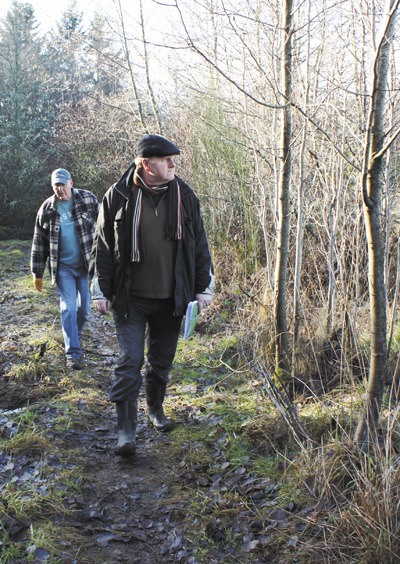David Kimmett and Tom Dean walk through a 40-acre forest behind Roseballen