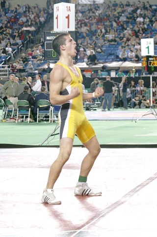 Rogen Lopez celebrates his 140-pound state championship. The Vashon senior broke a 2-2 tie with 15 seconds on the clock to take a 4-2 decision. Lopez was 130-pound state champion in 2007 and finished third at 135 pounds in 2008.