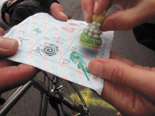 A cyclist gets his 'passport' stamped at one of the stops along last year's route.