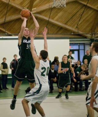 Charlie Hoffman shoots over the Charles Wright Academy defense on Jan. 21.