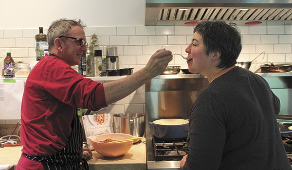 Daniel Ahern and Shauna James Ahern sample a recipe in their test kitchen.