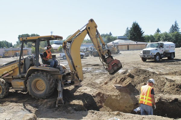 A construction crew works to bury underground utilities at Vashon High School last week.