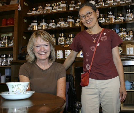 Rose Ellen Albers and Beng-Imm Low share a moment at the Vashon Tea Shop.