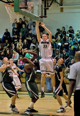 Senior Charles Hoffman shoots over the Charles Wright defenders Feb. 13.