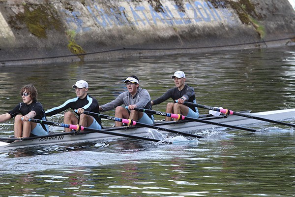 The junior men’s quad heads into the final 500 meters at Saturday’s Husky Open. From left