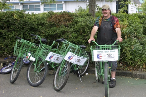 Jeff Ammon shows off some of Vashon’s new bike share bicycles.
