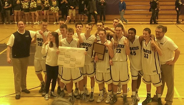 The team celebrates winning the District 3 title last Friday. The boys will play their first game of the State competition at 8 p.m. Friday in Puyallup.