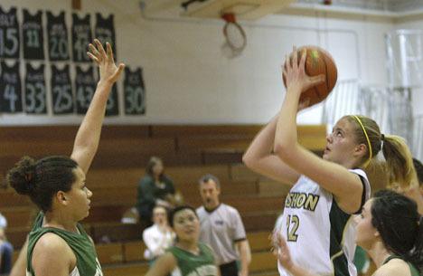 Elisa Wendt puts up a shot early in Wednesday’s Charles Wright basketball game.