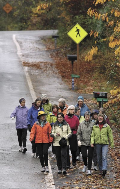 More than a dozen women donned raincoats and went for a walk one recent Saturday.