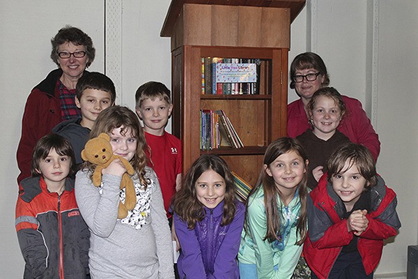 Several students in Jenni Wilke’s third-grade class at Chautauqua pose for a photo after donating a Little Free Library to the Vashon food bank last week. Wilke