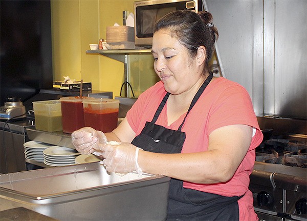 Patty Freebourn makes her tamales at Express Cuisine.