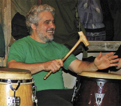 Geoff John plays in a drum circle in 2010.