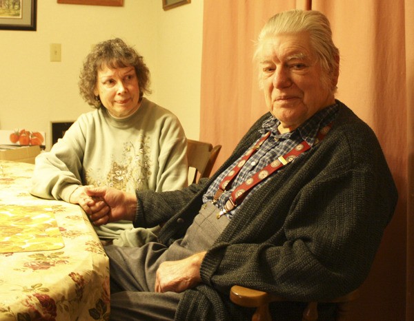 Roger Hammett sits with his wife Anita at their home on Monument Road.
