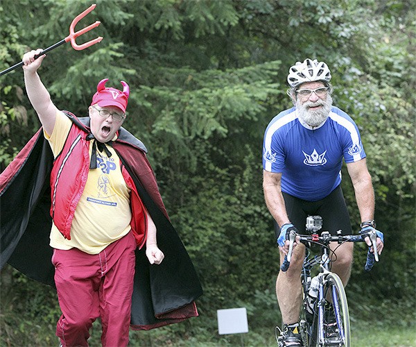 Jim Marsh as the Burma Road Devil chases Peter Ray at last year’s ride.