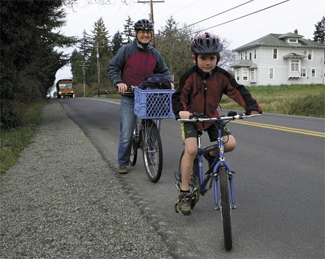 Zach Van Dusen and his mother Karen Fevold ride their bikes to Chautauqua Elementary most mornings.