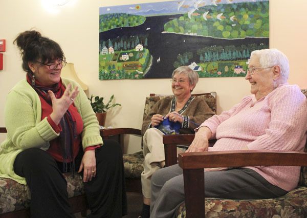 Michele Kimble shares a laugh with J.G. Common residents Sue Knight