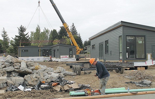 The construction site was a busy scene when the prefabricated lodges were set on their foundations