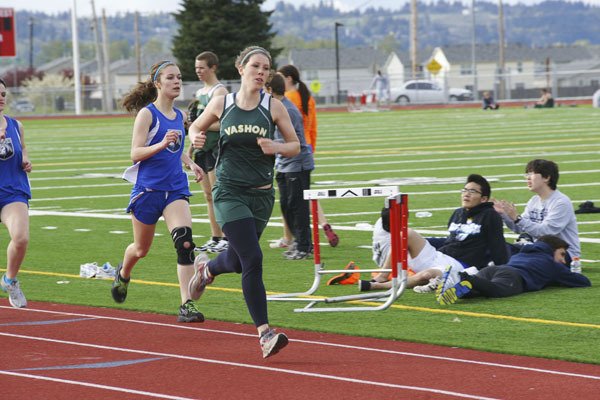 Vashon senior Alia Payne takes the lead midway in the 800-meter run. Payne entered the event for the first time since eighth grade and established herself as third-best in the Nisqually League this season.