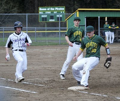 Ryan Bernheisel makes an out at first with Chester Pruett behind him in the game against Fife.