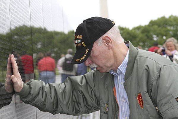 Vietnam veteran Chris Gaynor visits the Vietnam Veterans Memorial on April 30