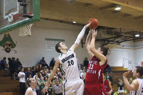 Pirate Alex Wegner rejects a fourth-quarter shot by Seattle Christian’s Chaise DeVries.