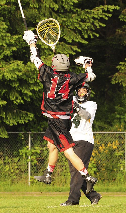 Goalie Marquis Stendahl clears over a Seattle Academy player at the recent State semi-final game on Vashon.
