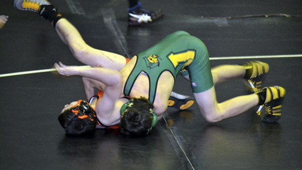 Pirate wrestler Luke Larson takes on an opponent from Kalama at Rainier on Saturday. Larson came in second that day.