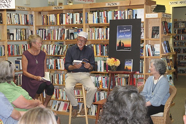 Sue and Rich Wiley read a scene from Jean Davies Okimoto's latest book 'The Reinvention of Albert Paugh' last week at the Vashon Bookshop. Okimoto is seated on the right.