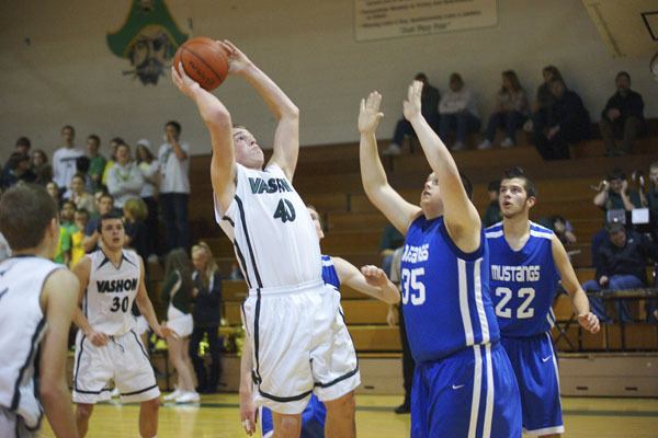 Owen Brenno puts up two of his 13 points in the Pirates’ home opener against Rainier Christian.