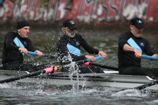 The bow of Vashon’s men’s masters eight overcomes tough water to win at Opening Day in the Montlake Cut. Pictured