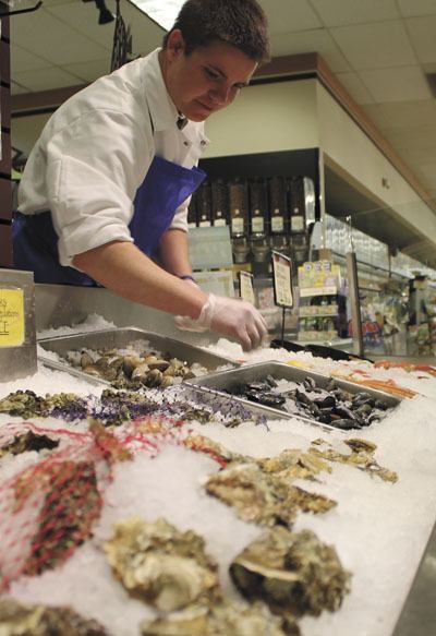 Michael Pedrin works the fish counter at Vashon Thriftway