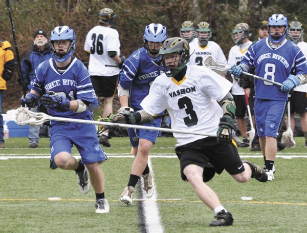 Vashon lacrosse player Nick Amundsen (3) is pursued by Three Rivers players during Saturday’s away game. In the end