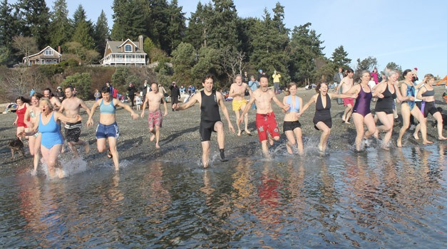 Islanders celebrated a new year on Tuesday by taking a plunge into a chilly Puget Sound.