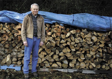 Jim Walker shows off the pile of wood at St. John Vianney.