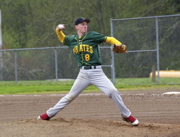 Josh Myer delivers a pitch in the first inning as the Pirates battle Cascade Christian on rain-soaked Jim Martin Field at Vashon High School last Tuesday.