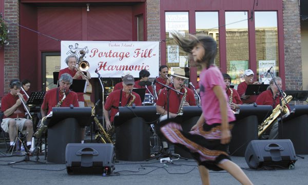A girl dances while the Portage Fill Big Band performs at Strawberry Festival two years ago.