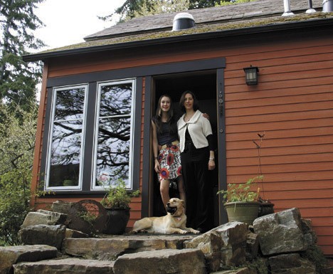 Emily Burns (right) and her daughter Mara say they're now warm in their 1907 farmhouse