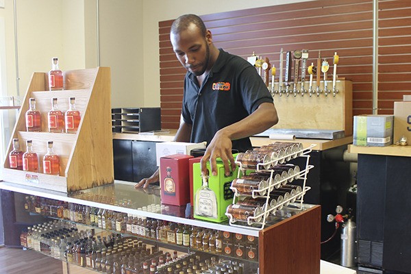 Vashon Liquor employee Cortez Ellison works at the store