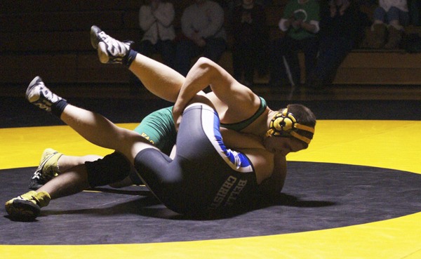 Pirate senior Christian Seymour turns Bellevue Christian sophomore Michael Dougherty to his back on the way to a 49-second pin in their 170-pound match. The fastest pin of the night also proved to be the match that assured the Pirates of an undefeated Nisqually League dual meet season.