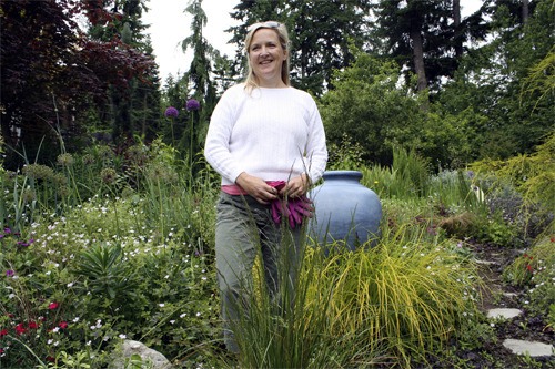 Colleen James surveys her garden in anticipation of this weekend’s garden tour.