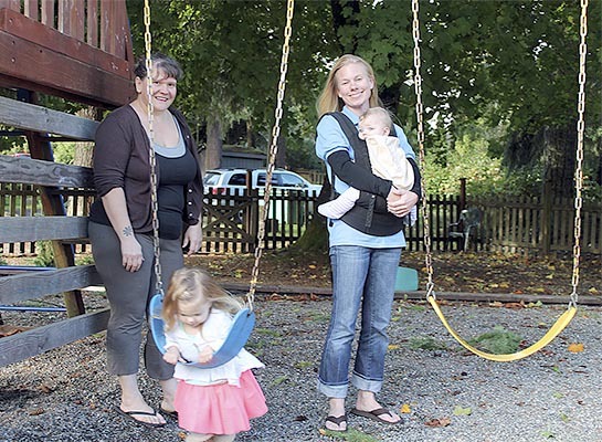 Sandy Gilliam and Amanda Lawson with Lawson's children spend some time outdoors at the VYFS PlaySpace