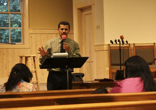 Pastor Edwin Alverado delivers a homily at a recent service.