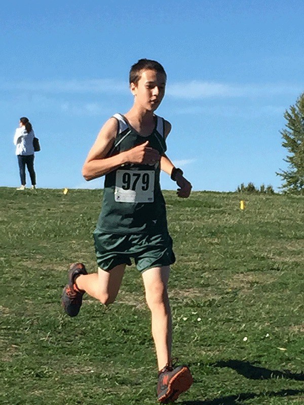 McMurray Middle School cross-country runner Cole Parks takes on a stretch of 1.5-mile course in Seattle Tuesday