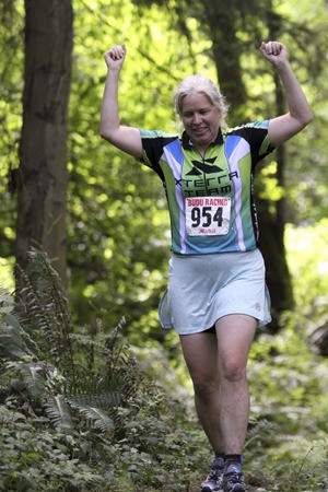 An athlete celebrates during the running portion of the XTERRA Vashon Off-Road Triathalon.