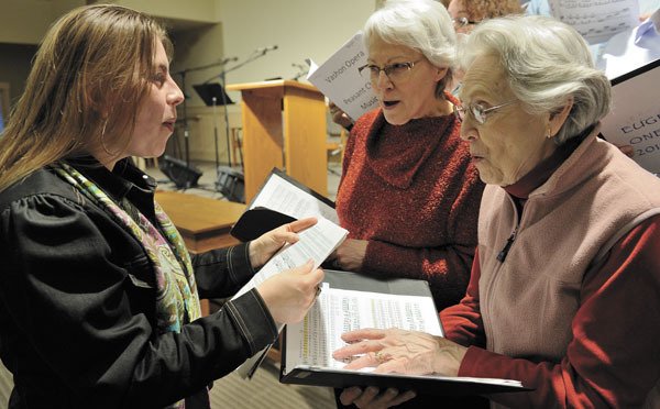 Maria Marcy works with Anne Terry and Conni Clark during a rehearsal.