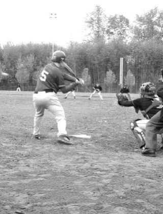 Chris Pieterick leans into his game-winning triple in Vashon’s extra-inning win against Seattle Christian.