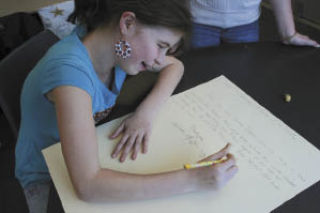 Lily Herrington was one of many students who made poster-sized letters to Sen. Maria Cantwell